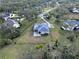Aerial view of the house, highlighting its backyard and the surrounding landscape at 13653 Heritage Way, Sarasota, FL 34240
