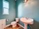 Simple bathroom with pedestal sink and updated fixtures at 13653 Heritage Way, Sarasota, FL 34240