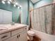 Simple bathroom with a shower/tub combo and white vanity at 13653 Heritage Way, Sarasota, FL 34240