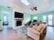 Light and airy living room with fireplace and plenty of natural light at 13653 Heritage Way, Sarasota, FL 34240