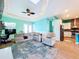 Open living room with kitchen views and comfortable seating at 13653 Heritage Way, Sarasota, FL 34240