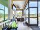 Relaxing screened porch with outdoor furniture and view of backyard at 13653 Heritage Way, Sarasota, FL 34240