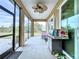 Spacious screened porch with outdoor kitchen and seating area at 13653 Heritage Way, Sarasota, FL 34240