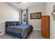 Spacious bedroom with a queen bed and wood dresser at 14215 Swiss Bridge Dr, Riverview, FL 33579