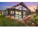 Backyard view of home with pool and lights at 14215 Swiss Bridge Dr, Riverview, FL 33579