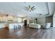 Open kitchen with white cabinets, granite counters, and island at 1840 Douglas Ave, Dunedin, FL 34698