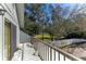 Private balcony overlooking trees and fenced yard at 1960 Union St # 42, Clearwater, FL 33763