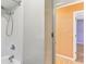 Simple bathroom with shower/tub and view into hallway at 1960 Union St # 42, Clearwater, FL 33763