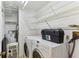 Clean laundry room with washer, dryer, and storage at 1960 Union St # 42, Clearwater, FL 33763