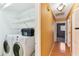 Laundry room with washer, dryer and shelving at 1960 Union St # 42, Clearwater, FL 33763