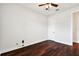 Bright bedroom with dark hardwood floors and ceiling fan at 20109 Sorano Hill Pl, Tampa, FL 33647