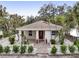 Front view of charming bungalow with brick walkway at 2077 5Th St, Sarasota, FL 34237