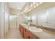 Double vanity bathroom with a large shower and tile flooring at 21042 Diamonte Dr, Land O Lakes, FL 34637