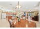 Open dining area with a view into the living room and kitchen at 21042 Diamonte Dr, Land O Lakes, FL 34637