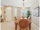 Formal dining room featuring a wood table and access to the kitchen at 21042 Diamonte Dr, Land O Lakes, FL 34637