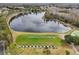 Community driving range with lake view at 21042 Diamonte Dr, Land O Lakes, FL 34637