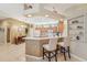 Eat-in kitchen with island, custom cabinetry, and breakfast bar at 21042 Diamonte Dr, Land O Lakes, FL 34637