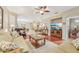 Spacious living room with hardwood floors, a comfy seating area and a view to the dining room at 21042 Diamonte Dr, Land O Lakes, FL 34637