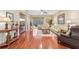Hardwood floor living room with large windows and a view of the backyard at 21042 Diamonte Dr, Land O Lakes, FL 34637