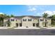 New townhome community with 4-unit buildings, 2-car garages, and attractive landscaping at 226 Royal Spoonbill Dr, Ruskin, FL 33570