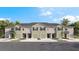 New townhome community with 4-unit buildings, 2-car garages, and attractive landscaping at 226 Royal Spoonbill Dr, Ruskin, FL 33570