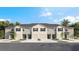 New townhome community with 4-unit buildings, 2-car garages, and attractive landscaping at 226 Royal Spoonbill Dr, Ruskin, FL 33570