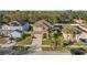 Aerial view of a residential area with houses, trees, and street at 2307 Dakota Rock Dr, Ruskin, FL 33570