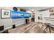 Spacious basement recreation area with large screen TVs and wet bar at 2307 Dakota Rock Dr, Ruskin, FL 33570