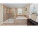 Bathroom with walk-in shower and soaking tub at 2307 Dakota Rock Dr, Ruskin, FL 33570