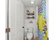 Small bathroom with shower and shelf at 2307 Dakota Rock Dr, Ruskin, FL 33570
