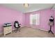 Pink bedroom with a window and carpet at 2307 Dakota Rock Dr, Ruskin, FL 33570