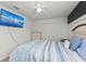 Bedroom with large TV and ceiling fan at 2307 Dakota Rock Dr, Ruskin, FL 33570