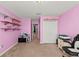 Pink bedroom with built-in shelving at 2307 Dakota Rock Dr, Ruskin, FL 33570