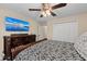 Bedroom with large TV and ceiling fan at 2307 Dakota Rock Dr, Ruskin, FL 33570