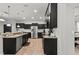 Modern kitchen with dark cabinetry and granite countertops at 2307 Dakota Rock Dr, Ruskin, FL 33570