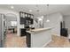 Open kitchen with granite countertops and dark cabinets at 2307 Dakota Rock Dr, Ruskin, FL 33570