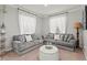 Cozy living room with two grey sofas and a coffee table at 2307 Dakota Rock Dr, Ruskin, FL 33570
