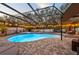 Enclosed pool and spa with patio furniture at 2307 Dakota Rock Dr, Ruskin, FL 33570