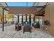 Covered patio with seating area and ceiling fan, adjacent to pool at 2307 Dakota Rock Dr, Ruskin, FL 33570
