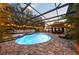 Screened pool and spa with patio furniture at 2307 Dakota Rock Dr, Ruskin, FL 33570