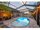 Enclosed pool area with patio and string lights at 2307 Dakota Rock Dr, Ruskin, FL 33570