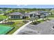Community clubhouse with parking and surrounding landscape at 2471 Overfalls Pl, Wesley Chapel, FL 33543