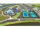 Tennis and pickleball courts with a large parking area nearby at 2471 Overfalls Pl, Wesley Chapel, FL 33543