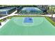 Outdoor basketball court with green surface and seating at 2471 Overfalls Pl, Wesley Chapel, FL 33543