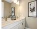 Double vanity bathroom with quartz countertops at 2471 Overfalls Pl, Wesley Chapel, FL 33543
