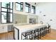 Modern community kitchen with island and bar seating at 2471 Overfalls Pl, Wesley Chapel, FL 33543