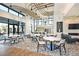 Large community room with modern kitchen and seating at 2471 Overfalls Pl, Wesley Chapel, FL 33543