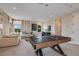 Fun game room with ping pong table and seating area at 2471 Overfalls Pl, Wesley Chapel, FL 33543