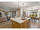 Modern kitchen with island and open layout at 2471 Overfalls Pl, Wesley Chapel, FL 33543
