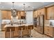 Modern kitchen with stainless steel appliances and island at 2471 Overfalls Pl, Wesley Chapel, FL 33543